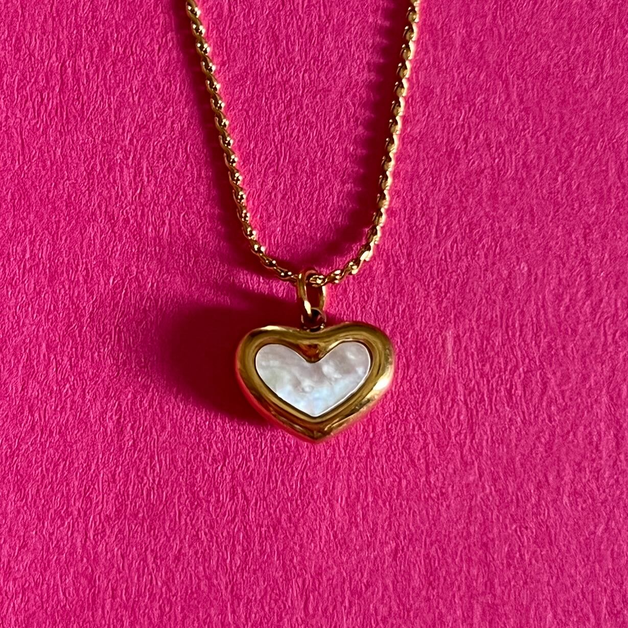 white heart gold pendant